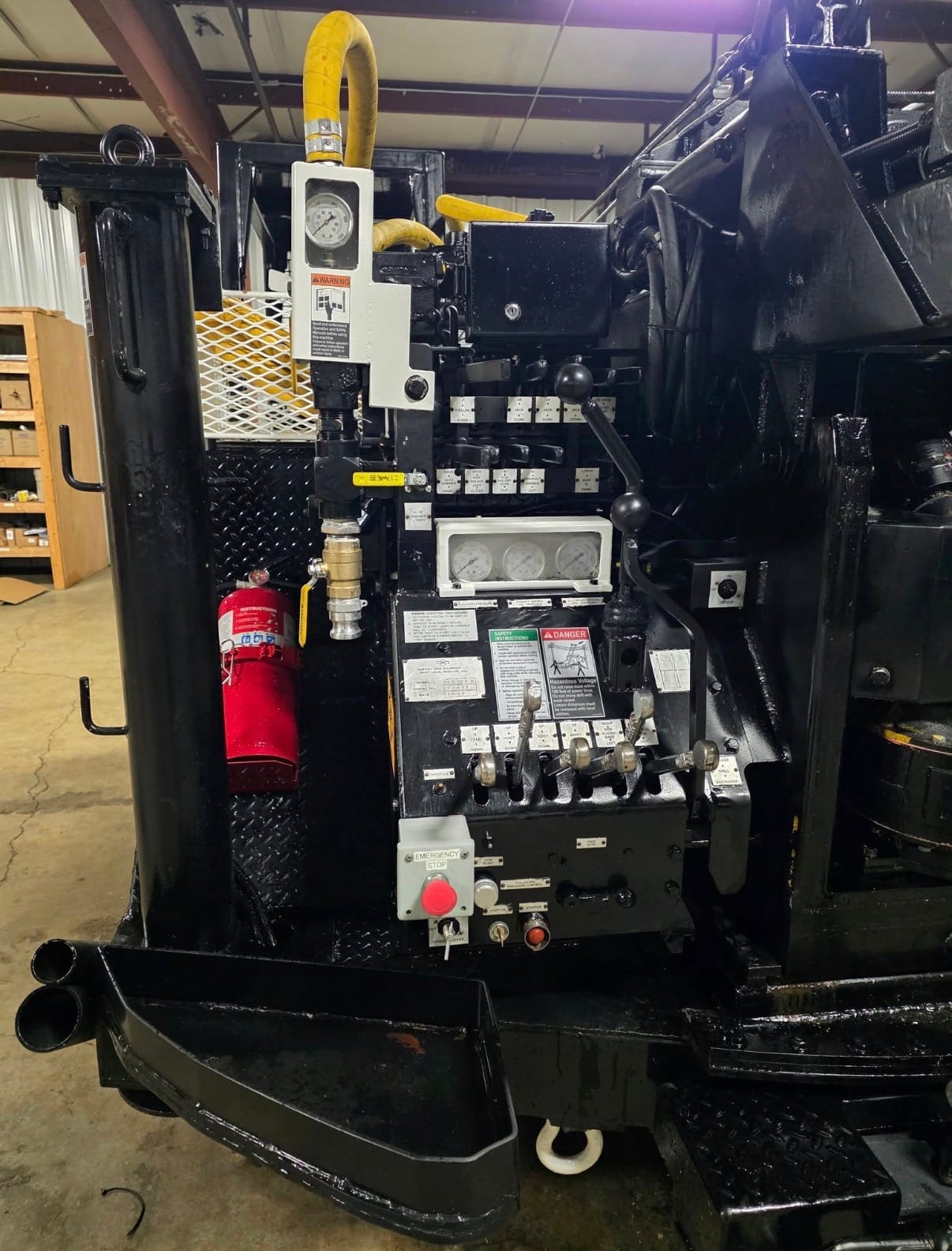 Operator at a drilling rig control panel.